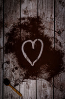 Wooden old planks printed on vinyl. Backdrop is used for food photography. Coffee powder is made in a heart shape. 